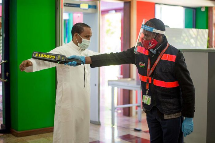 A traveler goes through checks at a local airport