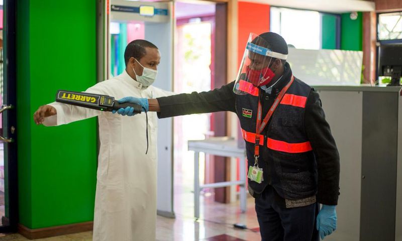 A traveler goes through checks at a local airport