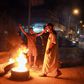 Libyan youth block a road with burning tyres in the eastern city of Benghazi to protest against poor public services and living conditions