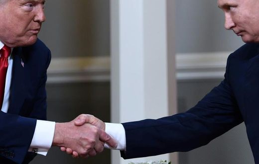 US President Donald Trump and Russian President Vladimir Putin, who are considering a new summit alongside other leaders, shake hands during a July 2018 meeting in Helsinki