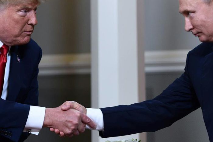 US President Donald Trump and Russian President Vladimir Putin, who are considering a new summit alongside other leaders, shake hands during a July 2018 meeting in Helsinki