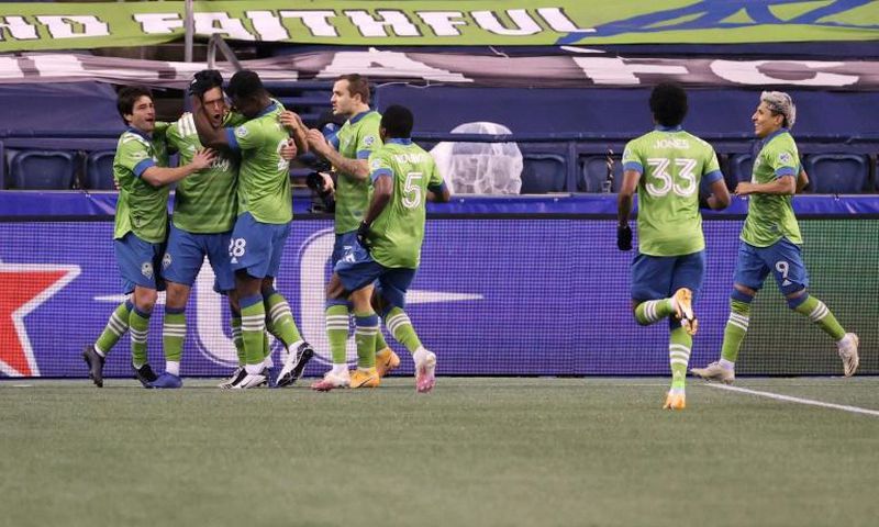 Irish defender Shane O'Neill, second from left, celebrates his goal with Seattle teammates as the Sounders defeated Dallas 1-0 on Tuesday in a Major League Soccer playoff quarter-final match