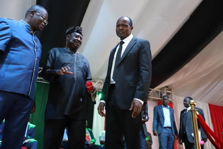 File image of Ochillo Ayacko with Raila Odinga and Okoth Obado