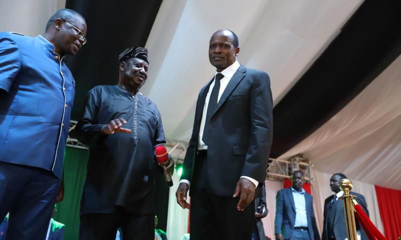 File image of Ochillo Ayacko with Raila Odinga and Okoth Obado