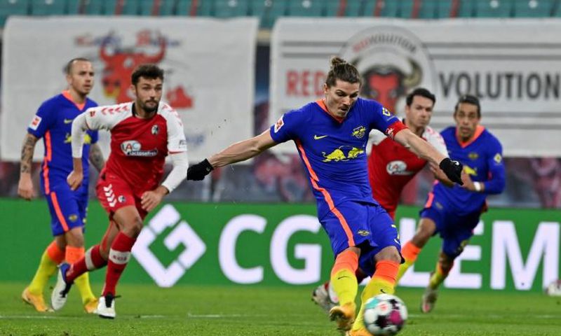 Marcel Sabitzer converts the penalty which sealed RB Leipzig's 2-0 home win over Freiburg on Saturday