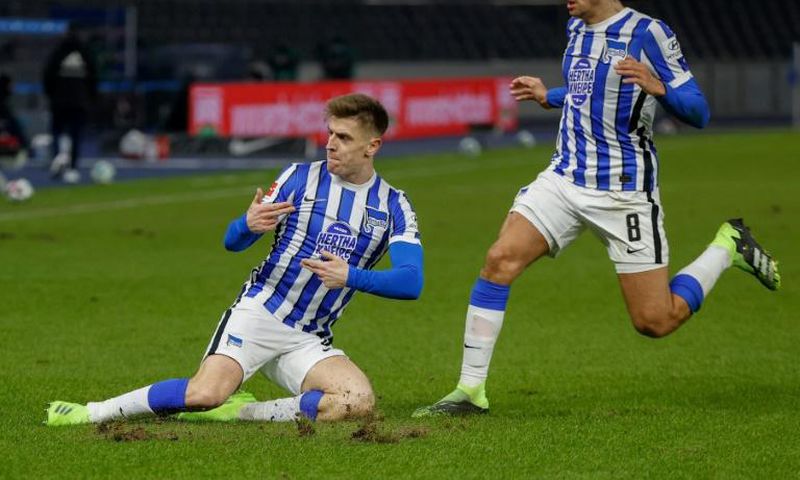 Hertha Berlin forward Krzysztof Piatek (L) celebrates scoring against FC Union on Friday