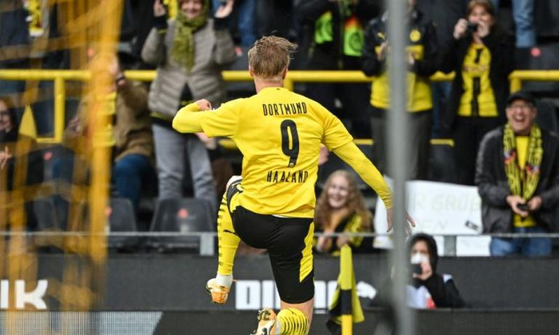 Erling Braut Haaland celebrates scoring for Dortmund at home to Freiburg