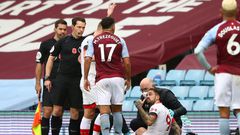Southampton striker Danny Ings gestures as he gets attention for the knee injury