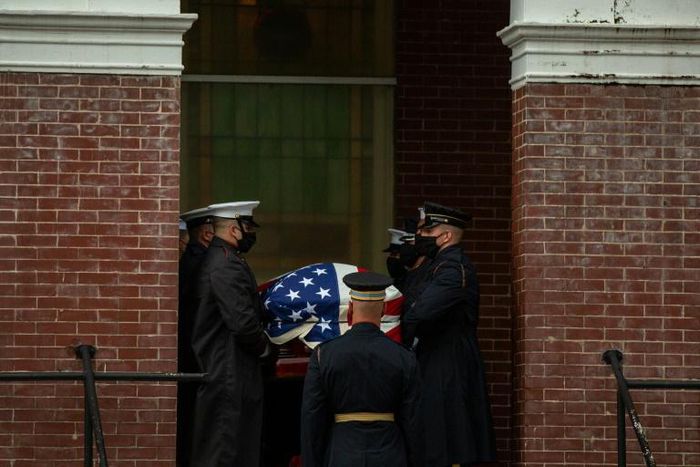 Military pallbearers on July 25, 2020 carry the body of civil rights leader John Lewis into a Selma, Alabama church; a day later his casket was escorted in a final solemn procession across the Selma bridge where he was beaten during a 1965 protest