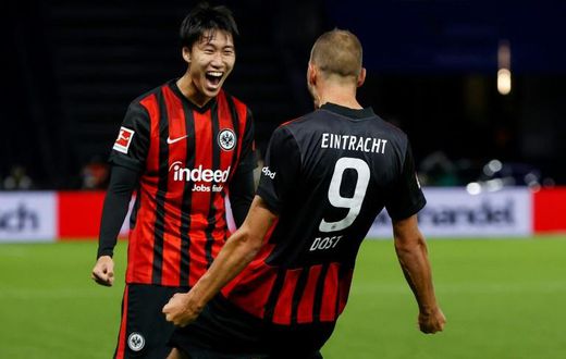 Eintrach Frankfurt's Daichi Kamada celebrates Bas Dost's goal in the Hertha Berlin win