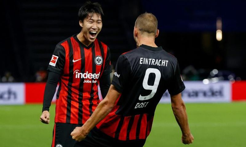 Eintrach Frankfurt's Daichi Kamada celebrates Bas Dost's goal in the Hertha Berlin win