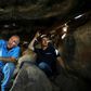 Uri Berger (R), a regional archaeologist for the Israel Antiquities Authority, and Gonen Sharon, a professor of archaeology at northern Israel's Tel-Hai college, display ancient engravings inside a dolmen