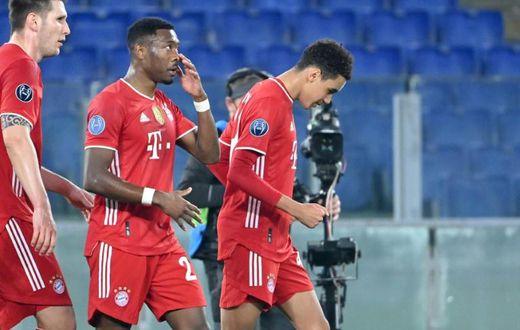 Bayern Munich's England Under-21 midfielder Jamal Musiala (R) celebrates scoring his first Champions League goal