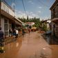 A flooded street in the village of Politika on Greece's Evia island, after torrential rains caused mass damage