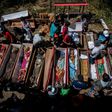 Torajan families unearth deceased relatives and clean their graves in a ritual known as "Manene"