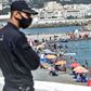 Algerians throng a beach in the Bab el-Oued suburb of the capital Algiers after authorities reopened beaches for the first time following a five-month coronavirus lockdown
