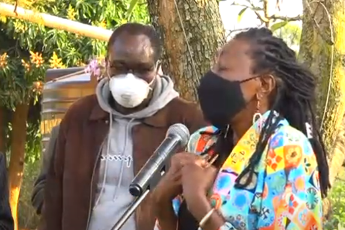 Actress, radio presenter Jacqueline Nyaminde "Wilbroda" addresses mourners during the burial of Charles Bukeko alias "Papa Shirandula"