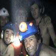 In this handout file photo released by Chile's mining ministry and taken on September 17, 2010, trapped Chilean miners pose inside the San Jose mine during their harrowing ordeal