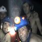 In this handout file photo released by Chile's mining ministry and taken on September 17, 2010, trapped Chilean miners pose inside the San Jose mine during their harrowing ordeal