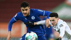 Ozan Kabak (L) in action for Schalke against Augsburg in the Bundesliga earlier this season