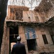 Ranj Abderrahman Cohen, an Iraqi Kurdish Jew, stands before a ruined synagogue in Arbil, capital of the autonomous Kurdish region of northern Iraq