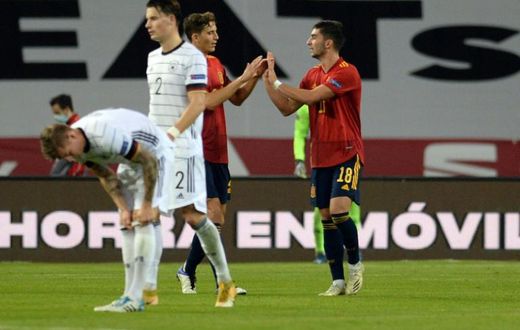 Ferran Torres (R) celebrates after completing his hat-trick in Spain's stunning 6-0 win over Germany