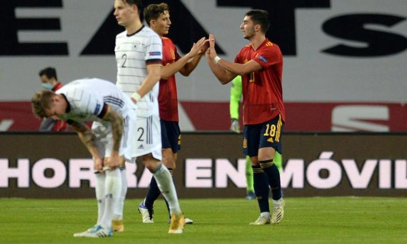 Ferran Torres (R) celebrates after completing his hat-trick in Spain's stunning 6-0 win over Germany