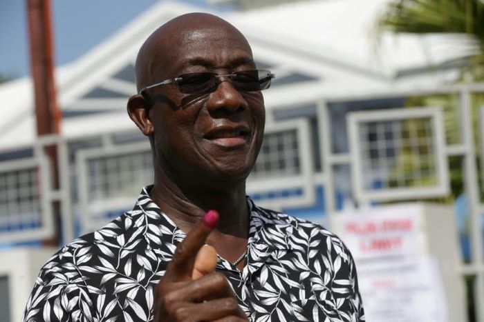 Prime Minister Keith Rowley shows the indelible ink mark on his finger after casting his vote in Westmoorings, west of Port-of-Spain, on August 10, 2020