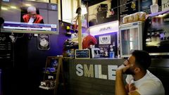 A Lebanese man watches the final verdict session of the Special Tribunal for Lebanon (STL) on former premier Rafic Hariri's assassination in 2005 at a coffee shop in the northern port city of Tripoli