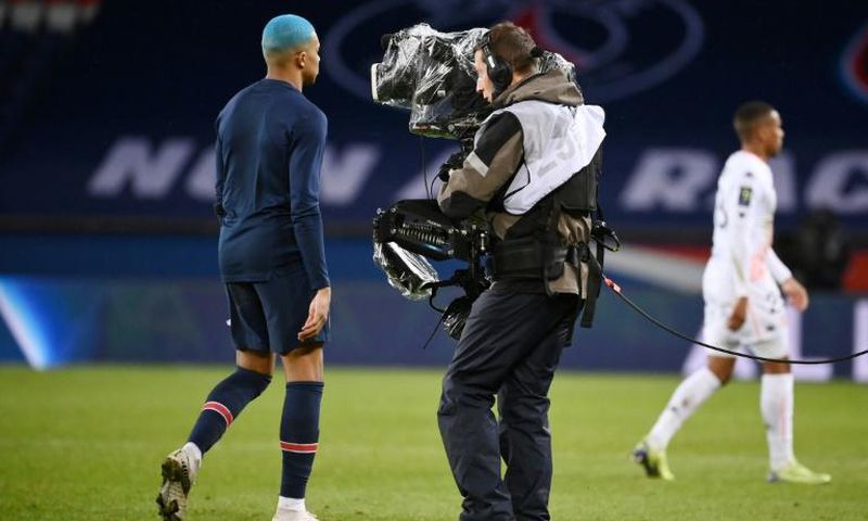 PSG superstar Kylian Mbappe walks past the camera -- the French league is hoping to agree a new domestic broadcast deal next week after the disastrous collapse of its record contract with Mediapro