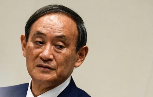 Yoshihide Suga was elected leader of Japan's ruling party putting him on track to become the country's next prime minister