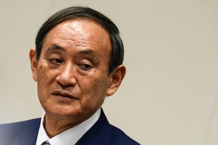 Yoshihide Suga was elected leader of Japan's ruling party putting him on track to become the country's next prime minister
