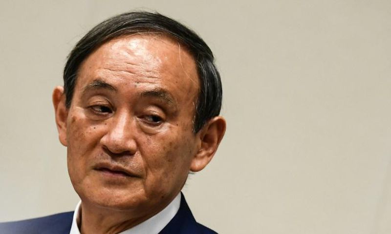 Yoshihide Suga was elected leader of Japan's ruling party putting him on track to become the country's next prime minister