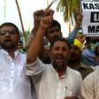Protesters in Karachi shout slogans during a rally to show solidarity with people of Indian-administered Kashmir on August 5