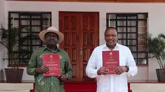 President Uhuru Kenyatta and Opposition Leader Raila Odinga receiving the final BBI Report