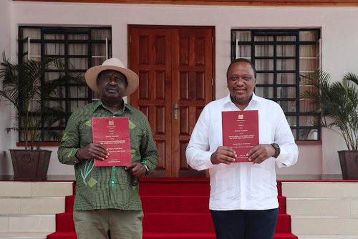 President Uhuru Kenyatta and Opposition Leader Raila Odinga receiving the final BBI Report