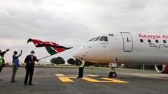 Transport CS James Macharia flags off a Kenya Airways plane during the resumption of local flights