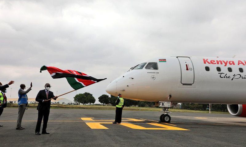 Transport CS James Macharia flags off a Kenya Airways plane during the resumption of local flights
