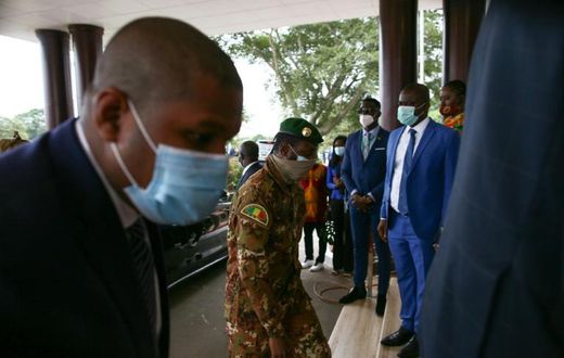 The head of the Malian military junta, Col. Assimi Goita, centre, arriving in Ghana for the ECOWAS summit