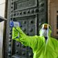 A medic outside Damascus's Umayyad Mosque checks the temperatures of worshippers before they are allowed to enter