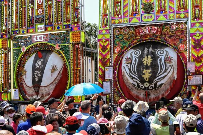 Festival goers looking at exhibits at Yimin temple in Hsinchu, northern Taiwan