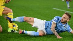 Lazio's Manuel Lazzari (R) scored an own goal against Hellas Verona.