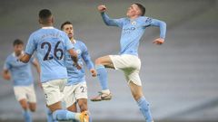 Manchester City midfielder Phil Foden (right) celebrates scoring against Brighton