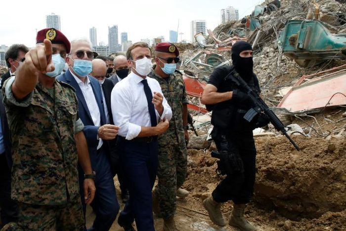 French President Emmanuel Macron visits the devastated site of the explosion at the port of Beirut on August 6