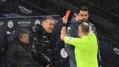 Referee Jon Moss (R) shows a red card to Aston Villa manager Dean Smith (L) during a 2-0 loss away to Manchester City on January 20