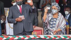 President Uhuru Kenyatta with First Lady Margaret Kenyatta after they received their Huduma Namba cads