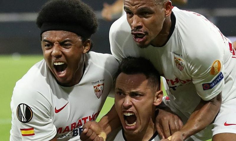 Lucas Ocampos (C) sent Sevilla to the Europa League semi-final with a late header that saw off Wolves