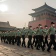 People's Liberation Army (PLA) soldiers march next to the entrance to the Forbidden City in Beijing