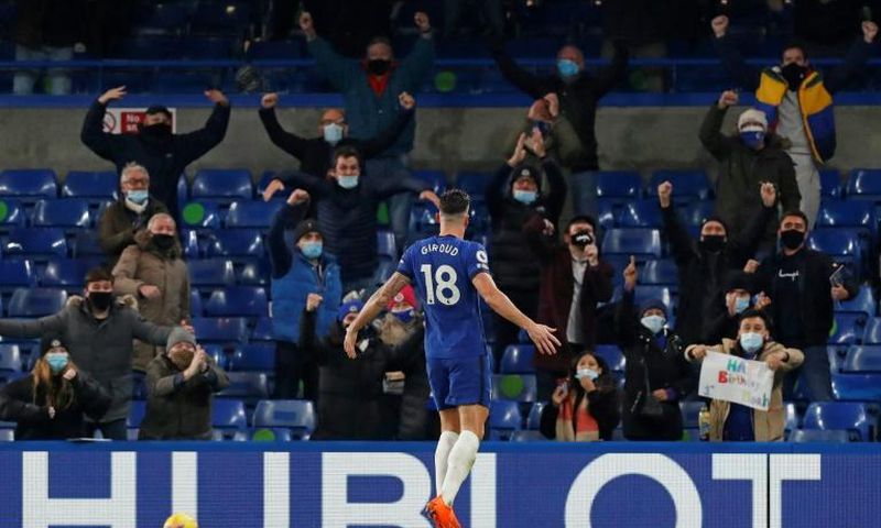 Olivier Giroud celebrates in front of the Chelsea fans, who were back at Stamford Bridge for the first time since March