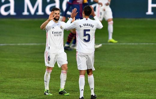 Real Madrid needed an unlikely double from Varane (R) to beat Huesca